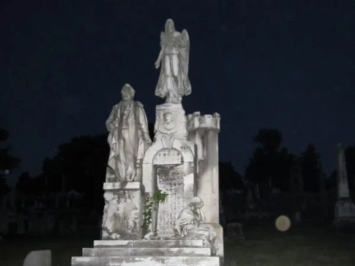 William Mullen's grave monument at night